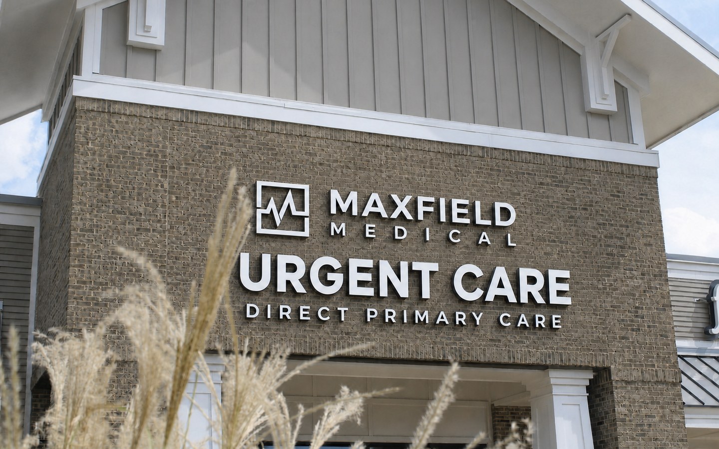 Maxfield Medical Urgent Care and Direct Primary Care signage on the building exterior in Cumming, Georgia